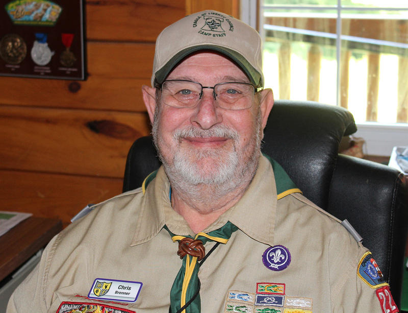 Chris Brenner sitting in his camp office